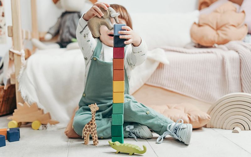 child playing with building blocks